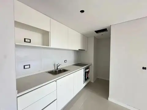 Departamento de dos dormitorios con cochera y amenities en venta