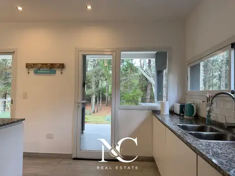 Casa en venta en Costa Esmeralda fondo arbolado