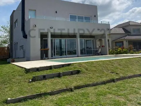 Alquiler casa en barrio privado El Canton con piscina y vista a la laguna