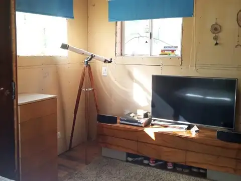 Casa estilo cabaña, construida en sistema woodframe.