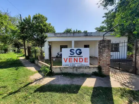 Gran terreno de 1500 m2 en San Lorenzo con casas y galpón edificado!