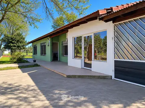 VENTA | PERMUTA - Casa de 2 dormitorios con local y garage en Pueblo Esther. APTO CRÉDITO.
