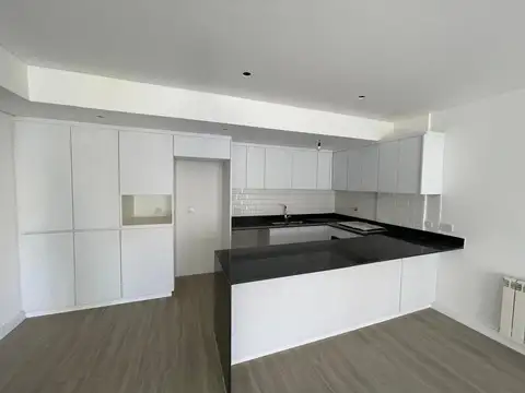 DEPARTAMENTO DE 3 AMBIENTES CON COCHERA DESCUBIERTA