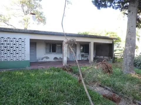 Chacra con casa y galpón, costa con arroyo Valdez