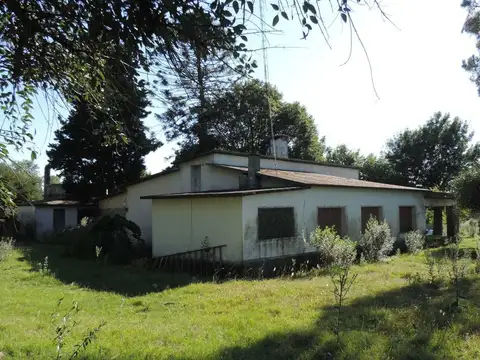 Chacra con casa y galpón, costa con arroyo Valdez