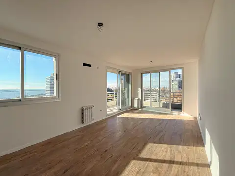 Venta. Departamento de 1 dormitorio con balcón, cochera y amenities - Distrito Puero Norte, Rosario.