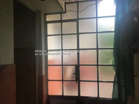 Lote con local y casa