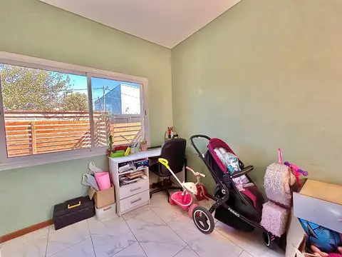 Casa multifamiliar con quincho,parrilla y terreno