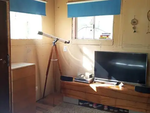 Casa estilo cabaña, construida en sistema woodframe.