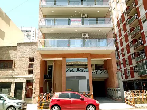 DEPARTAMENTO 2 AMBIENTES CON COCHERA. "A ESTRENAR". EDIFICIO CON PILETA, PARRILLA Y SUM.