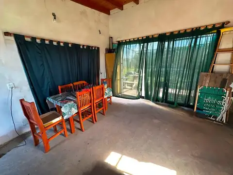 TERRENO CON CONSTRUCCION TIPO QUINCHO