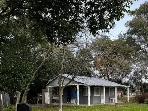 TERRENOS CON VIVIENDA PREFABRICADA  BARRIO LOS CACHORROS
