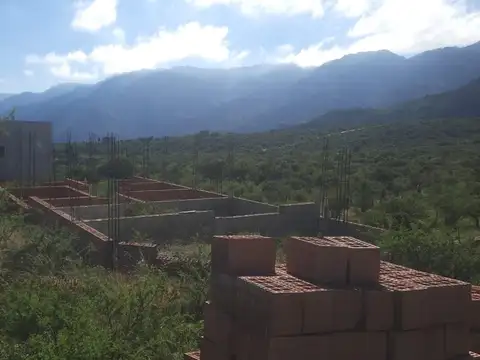 Terreno con casa a terminar