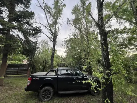 permuta por auto de alta gama Terreno en Roldan