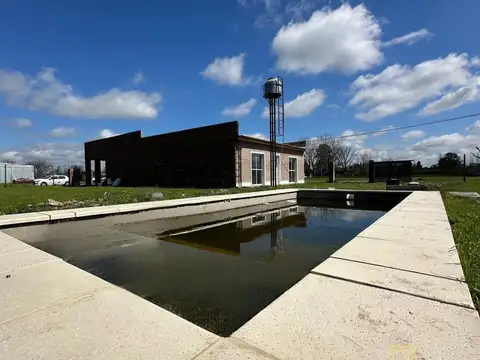 VENTA CASA TRES DORMITORIOS CON PILETA EN BARRIO LOS CEDROS ROLDAN