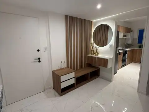 DEPARTAMENTO DE CUATRO AMBIENTES CON COCHERA.