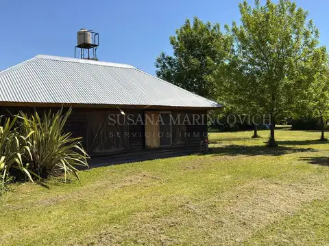 Terreno de Azcuenaga con cabaña y taller