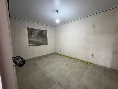CASA A ESTRENAR DE DOS DORMITORIOS,COCHERA PATIO.