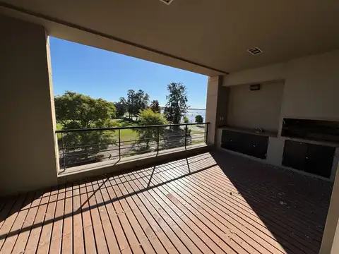 Departamento de un dormitorio con vista al rio y cochera