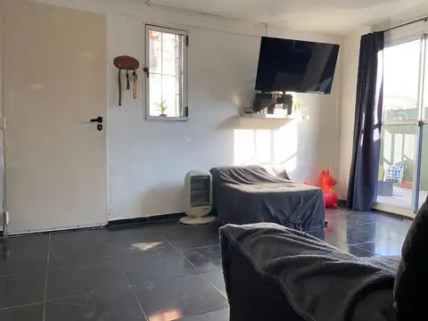 Casa de pasillo con dos viviendas