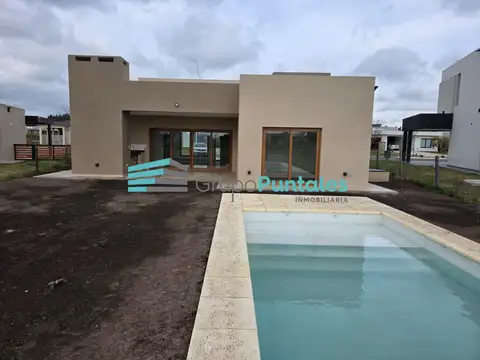 Casa a estrenar en Barrio San Felipe Canning con piscina y vista a espacio verde