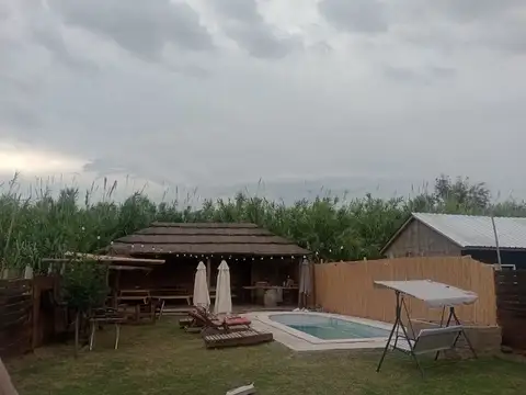 Terreno parquizado +quincho y pileta