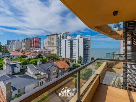 Excelente departamento en moderno edificio, en zona Playa Grande.
