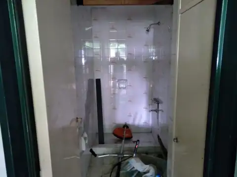 Lote Terreno con cochera quincho baño