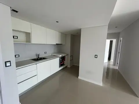 Departamento de dos dormitorios con cochera y amenities en venta