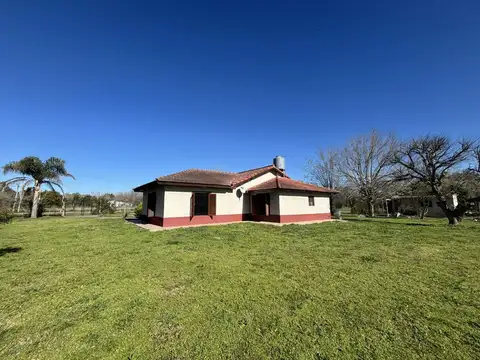 CAMPO EN VENTA EN ABASTO CON CASA Y LOCAL