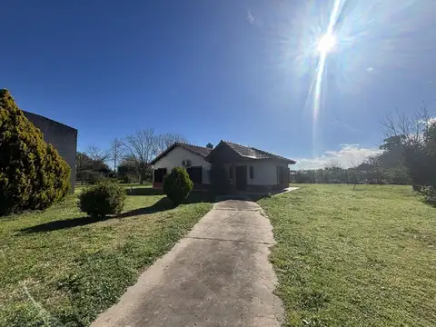CAMPO EN VENTA EN ABASTO CON CASA Y LOCAL