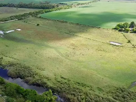 Chacra con casa y galpón, costa con arroyo Valdez