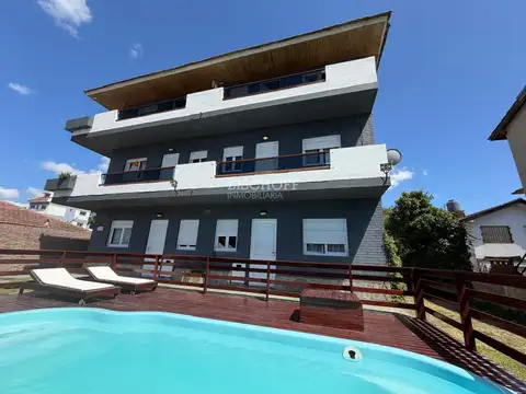 COMPLEJO DE 12 DEPARTAMENTOS CON PISCINA, ESTACIONAMIENTO Y QUINCHO