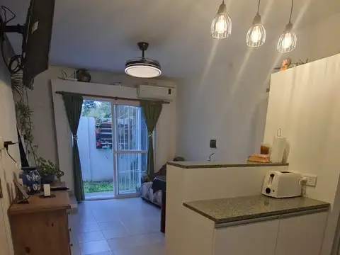 Vendo Departamento con cochera planta baja con patio excelente estado
