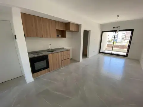 Dos ambientes en edificio con piscina y parrilla