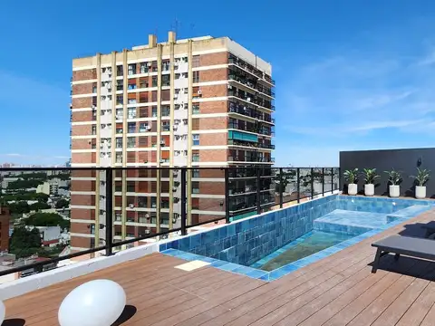 Un ambientes con balcon  y parrilla  !!